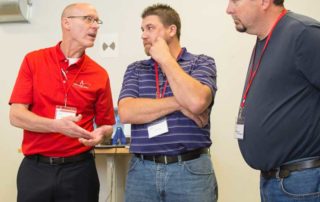 Dean Solberg, Vice President of Exact Metrology: A Division of In-Place Machining Company, talking to attendees.