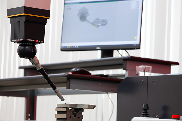 Coordinate Measuring Machine (CMM) probing a precision machined part