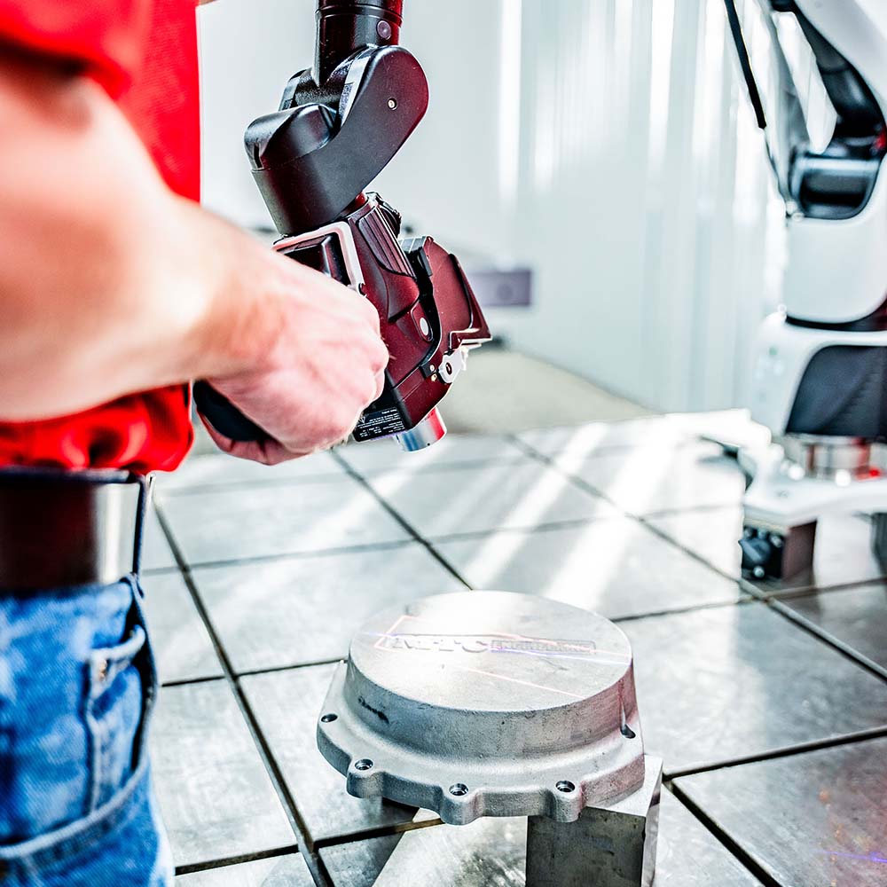 Metrologist 3D Scanning a Part with a Hexagon Absolute Arm