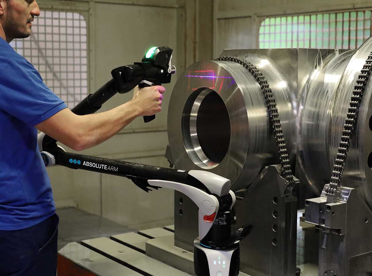 Absolute-Arm-7-Axis_Floating-card-3_1216x900 Applications engineer using portable measuring arm to scan a heavy industrial part